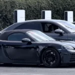 Electric-Porsche-Boxster-seen-plugged-into-Tesla-Supercharger-in-California.webp